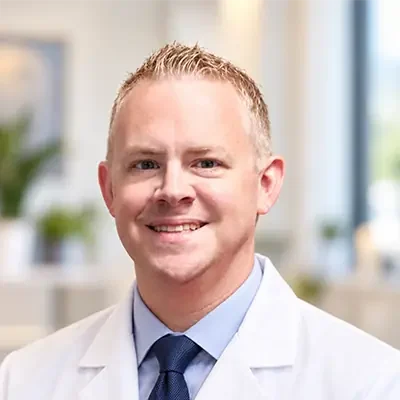 Dr. Craig Evans, a chiropractor, smiling at the camera